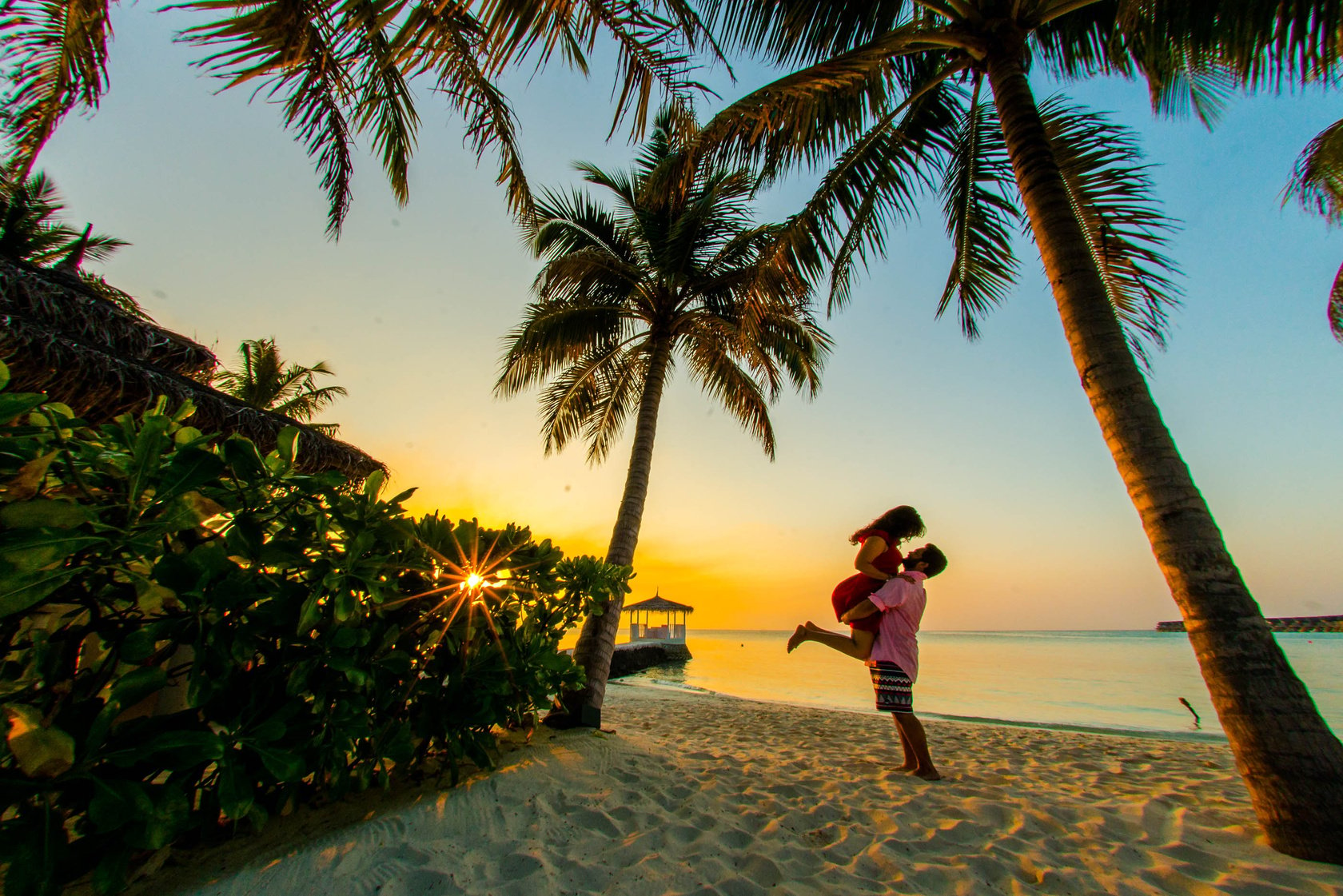 Man Carrying a Woman at the Beach